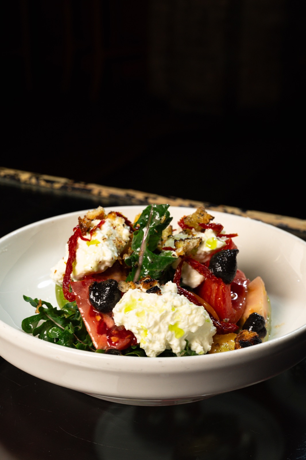 Heirloom tomato and arugula salad with stracciatella